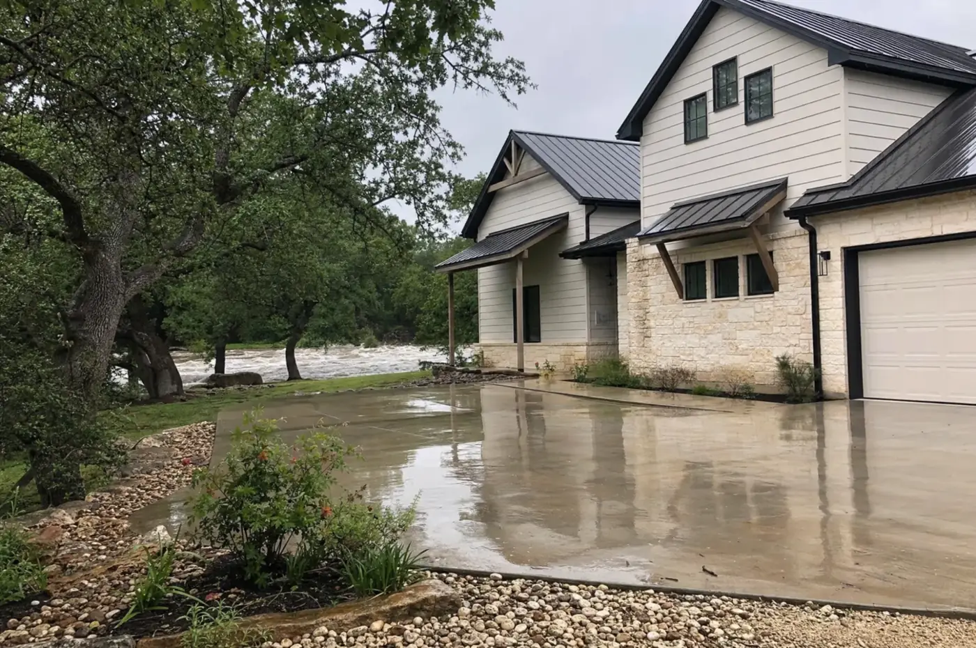 Hill Country home beside a flooding creek after heavy rain